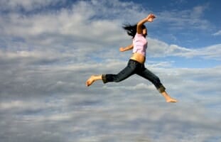Teen jumping for joy