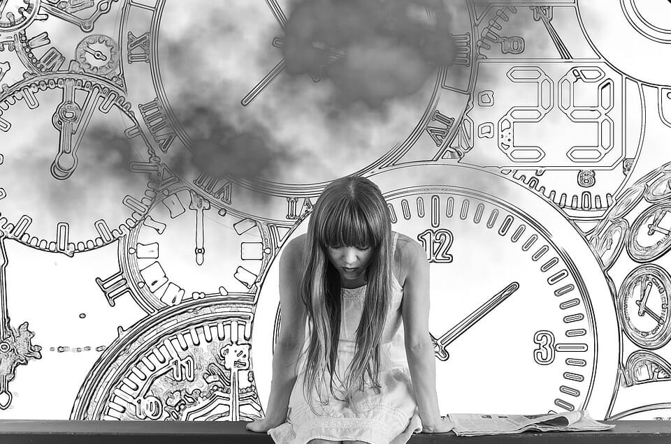 Woman with clocks in the background