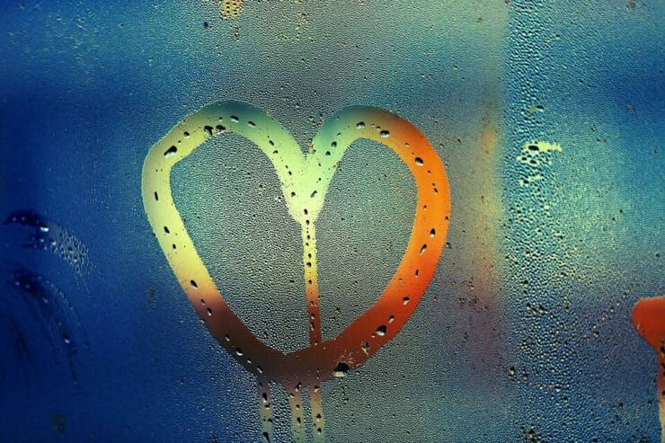 Heart drawn in window moisture