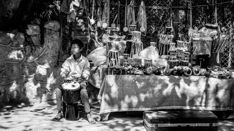 Boy at a drum stall