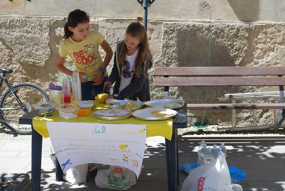 Two girls at a lemonade stand