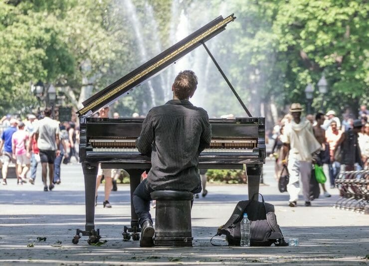 Man playing piano in a park