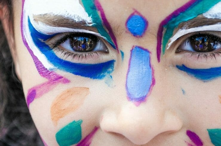 Visual girl with colorful face painting