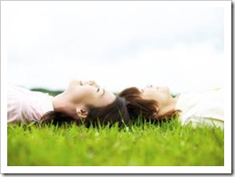 Girls lying on the grass