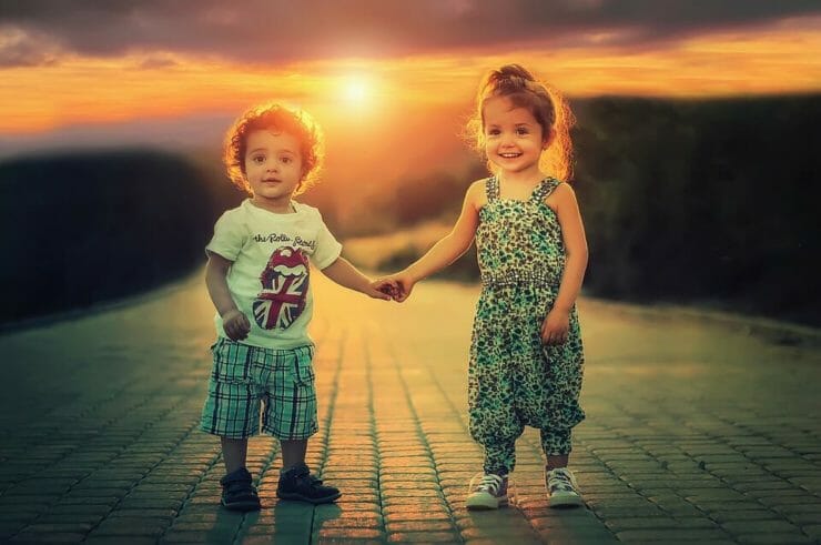 Little boy and girl holding hands