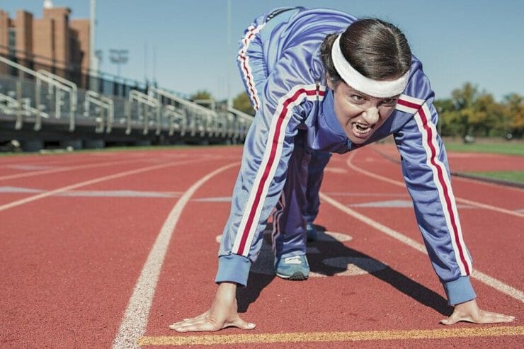Woman ready to sprint on a track