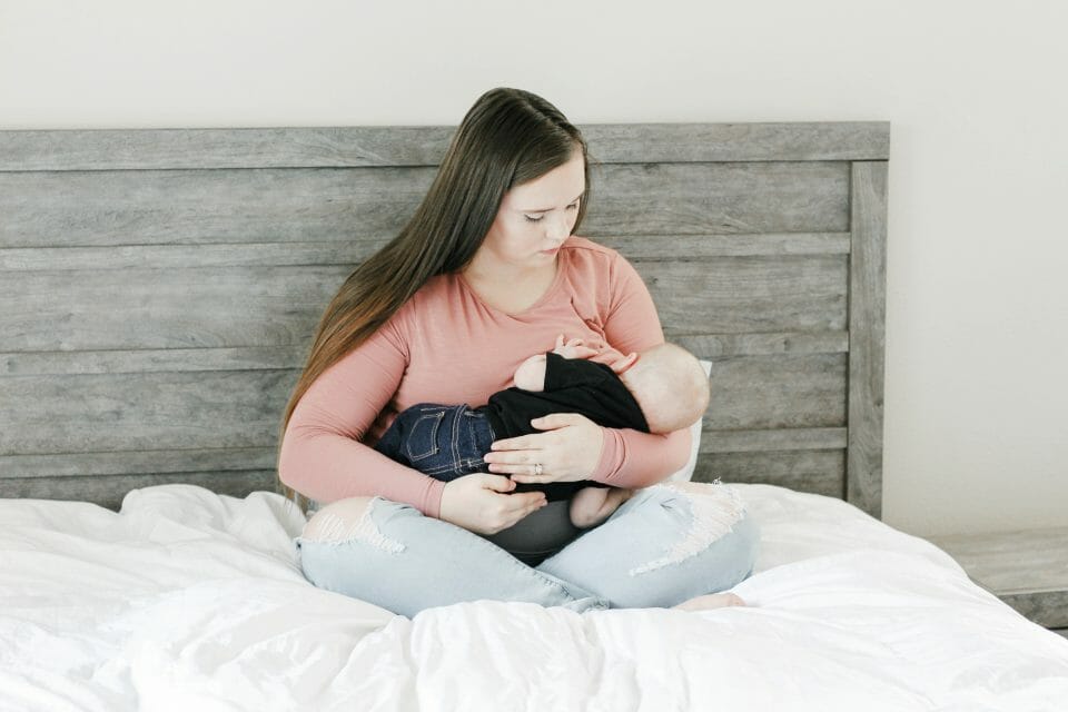 Woman holding a sleeping baby