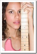 Young woman holding an electric guitar