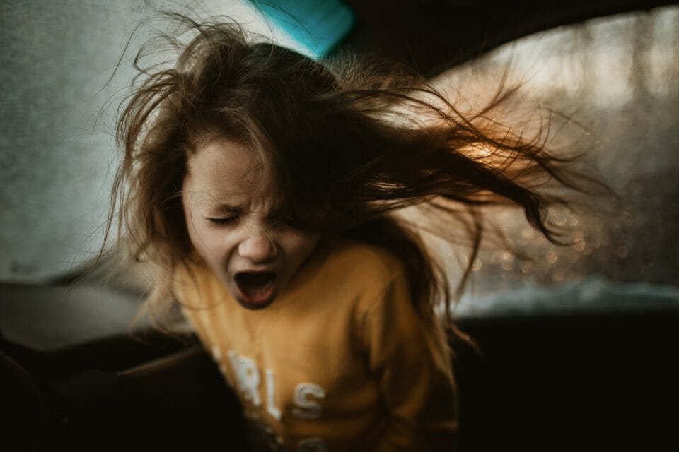 Girl shouting in a car