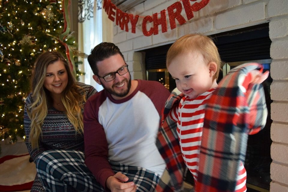 Couple with baby at Christmas