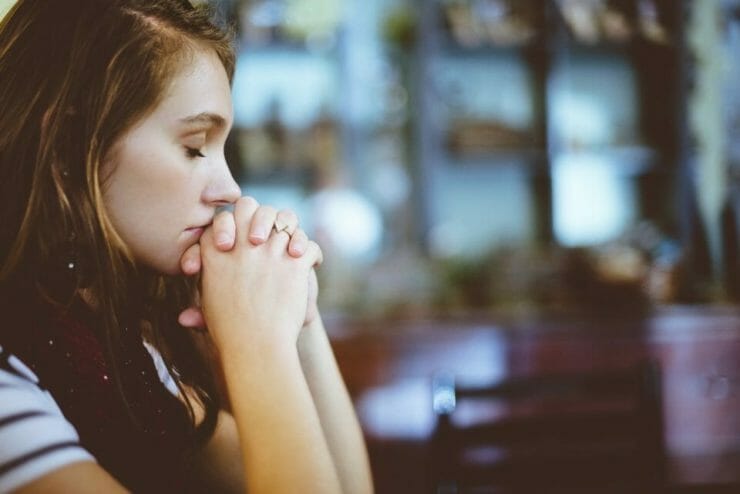 Woman praying to find hope
