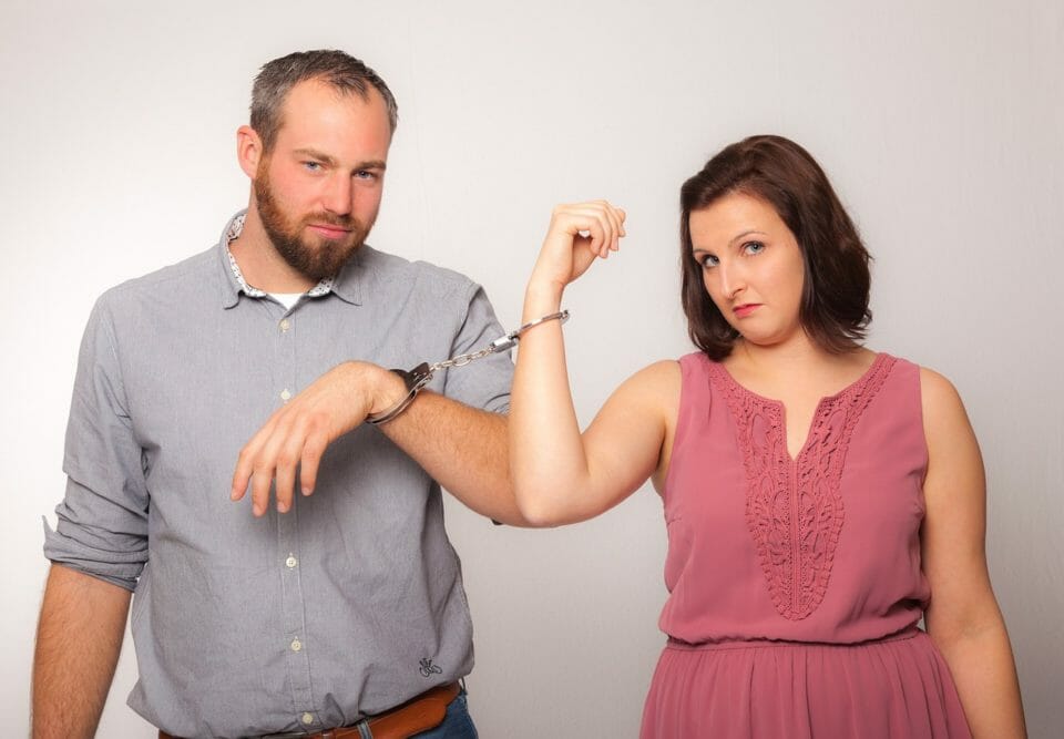 Couple handcuffed to each other