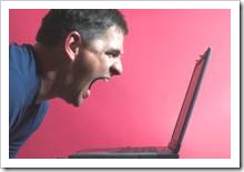 Man shouting at laptop