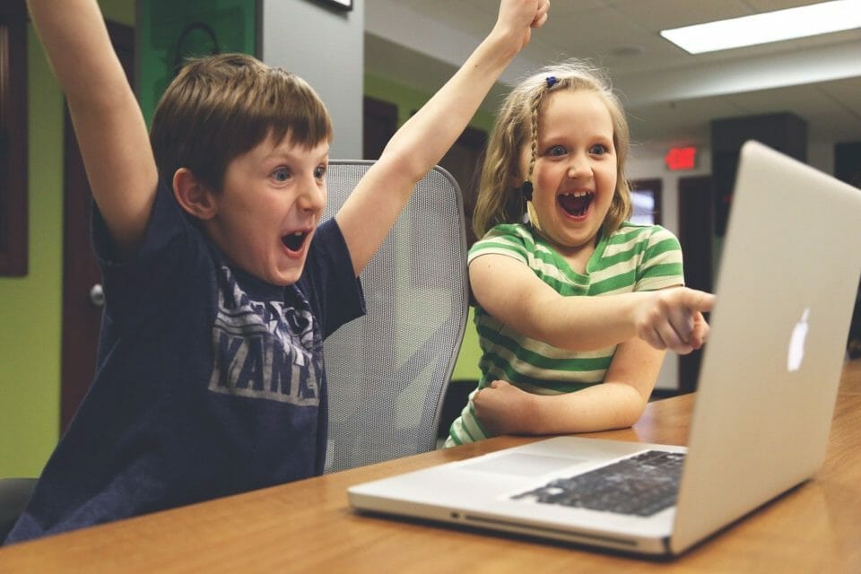 Kids having a success experience at the computer