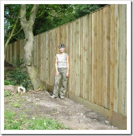 Woman inside a tall fence