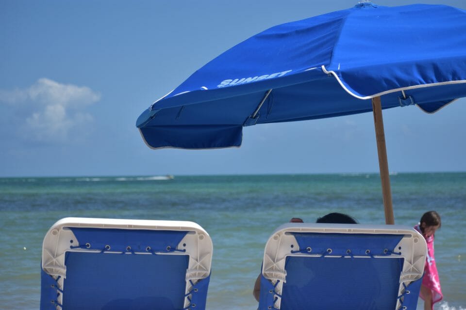 Blue and white beach umbrellas on beach