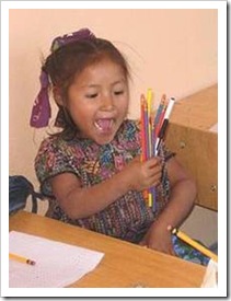 Excited girl with pencils