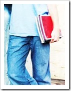 Teen boy holding books