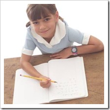 Girl writing in class