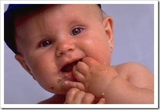 Cute baby boy with food on his face