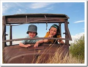 Kids playing in rusty car