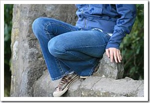 Person sitting on a rock