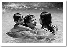 Father and kids in the pool