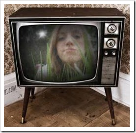 Teen looking out of old TV