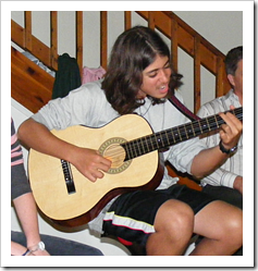 Teen playing guitar