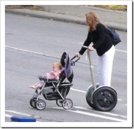 Mother pushing stroller on a Segway