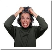 Frustrated woman pulling her hair out