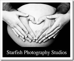 Heart-shaped hands on pregnant belly