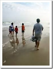 Parents and kids on beach