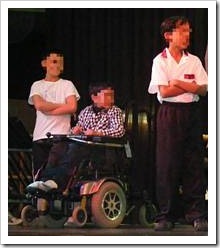 Disabled boy on stage