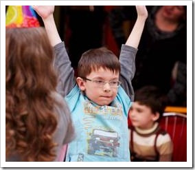 Boy raising his arms