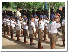 Primary school students saluting
