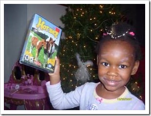 Girl holding new video game