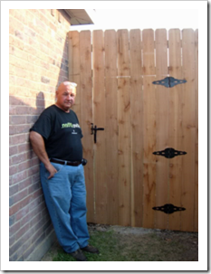 Man standing outside high gate