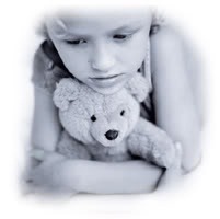 Sad girl with teddy bear