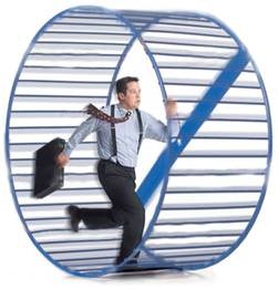 Man running in hamster wheel