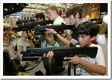 Kids shooting at a game arcade