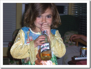 Little girl with beer bottle