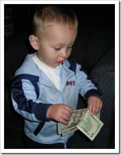 Little boy with money