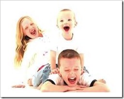 3 siblings laughing