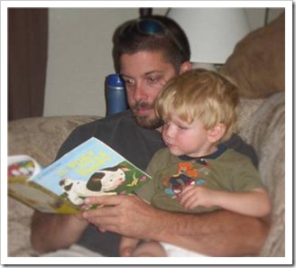 Father reading his son a story