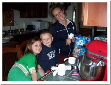 Mother and two kids in the kitchen