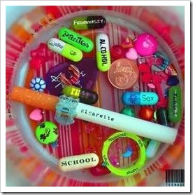 A bowl with pills, coins and a cigarette