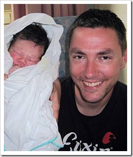 Happy father and newborn baby