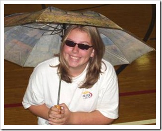 Woman smiling under umbrella