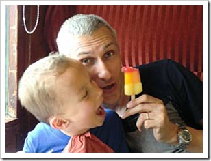 Father and son playing with popsicle